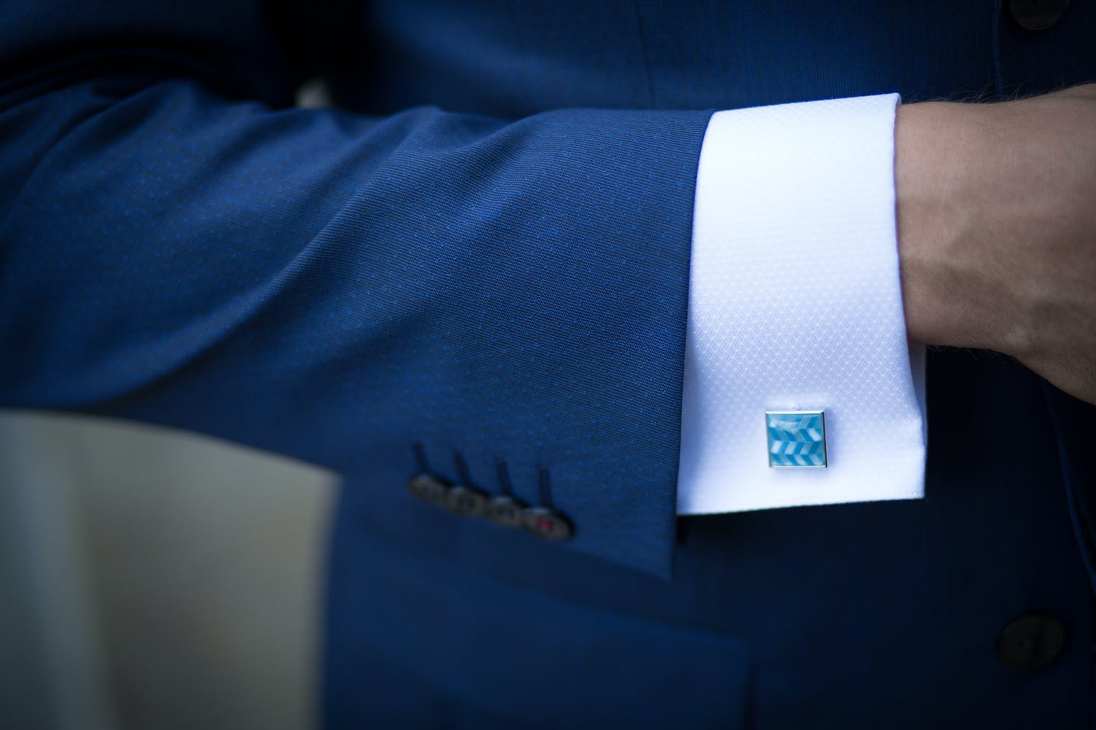 person wearing blue suit jacket
